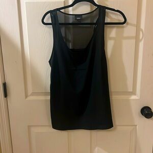 Brand new black top with see through up back. Much more than a tank top